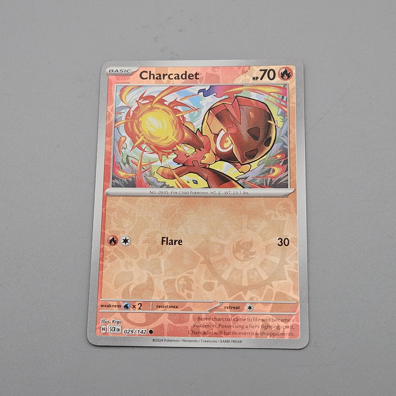 Charcadet Reverse Holo 029/142 Common SV07 Stellar Crown NM Pokémon